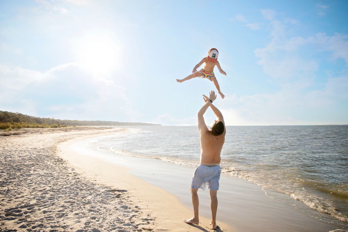 dad and kid on hilton head island beach