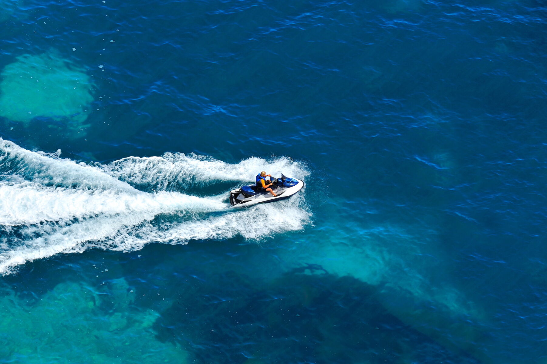 Aerial view of person on jet ski