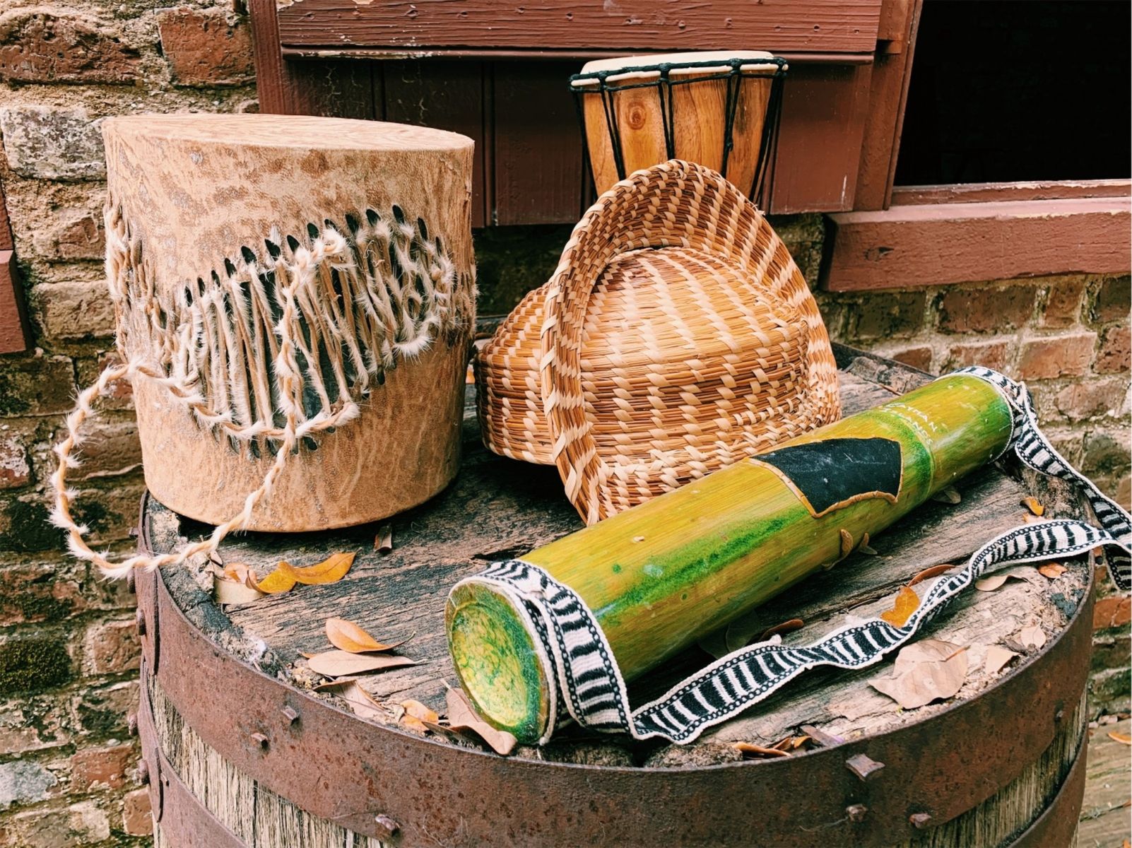 Historic Gullah pieces featuring strawgrass basket and musical instruments